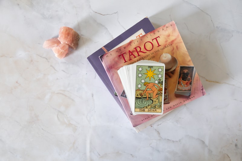 Tarot cards and crystals on a marble surface